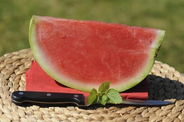 A piece of watermelon and a knife