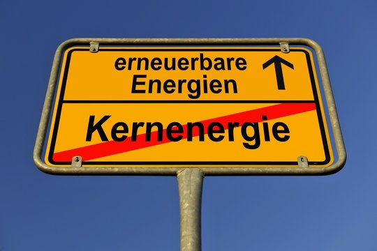 Symbolic image in the form of a town sign, in German, exit from nuclear energy, entrance into renewable energy sources