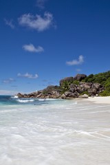 Obraz premium Lonely beach of Grand Anse, with the typical granite rocks of La Digue, La Digue Island, Seychelles, Indian Ocean, Africa