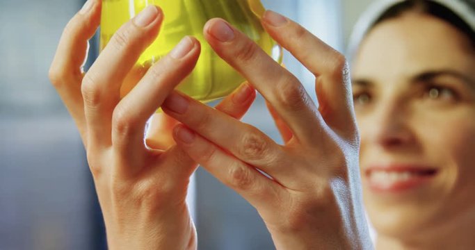 Technician examining olive oil