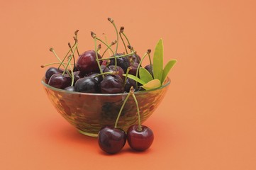 Fresh cherries in a glass bowl