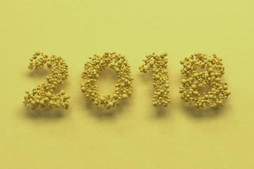 2018 number from yellow balls on yellow background