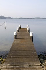 Obraz premium Jetty in the Maasholm fishing village, Schlei river, Schleswig-Holstein, Germany, Europe