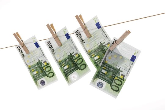 Euro banknotes hanging from a clothesline