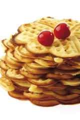 Stack of waffles with cherries