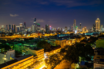Bangkok cityscape skyline, Thailand. Modern tower and local building, express way, road and vehicle,  and train station at twilight evening