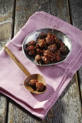 Dried mini-peppers lying on a rustic table