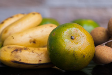 bananas and tangerines on the table