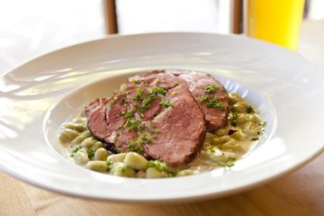 Gammon, smoked pork, with broad beans