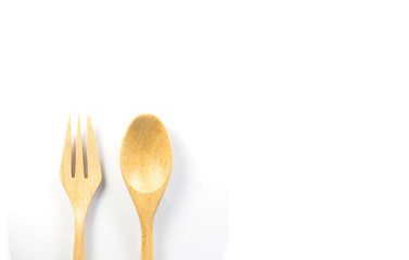 Wooden spoon and wooden fork on white background. Isolated