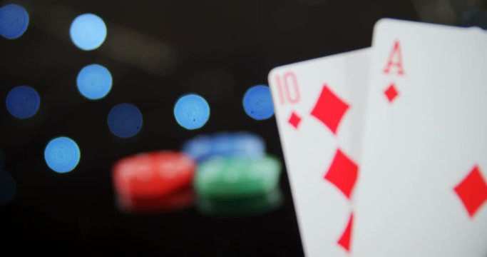 Stack of playing cards on poker table 