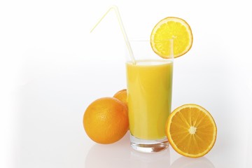 Oranges and orange juice in a glass