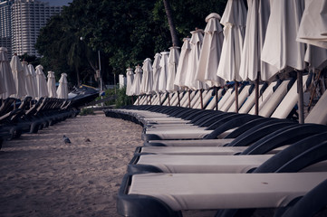 Empty sunbeds on the beach quarantine