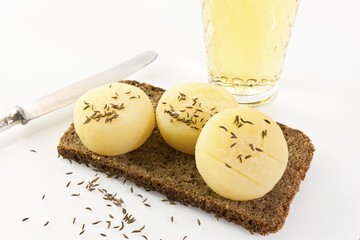 Traditional food of Frankfurt, German hand cheese or Harz cheese with caraway on dark rye bread and...