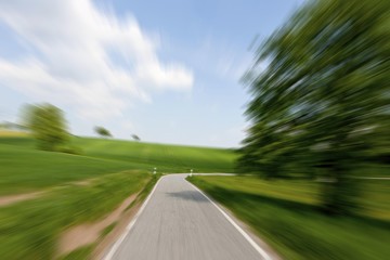 Fototapeta premium High speed motion, country road approaching a curve, Schoenbrunn, Baden-Wuerttemberg, Germany, Europe, PublicGround, Europe