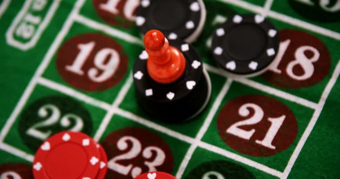 Casino chips on roulette on poker table 