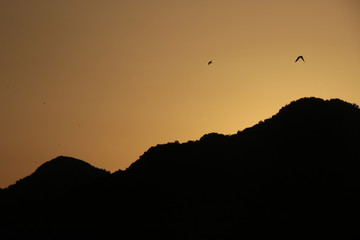 The black mountains of Montenegro in sunset light. Montenegro means: black mountain. Seen from Virpazar, Lake Skadar, in direction to the sea. Southeast Europe.