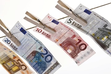 Euro banknotes hanging from a clothesline