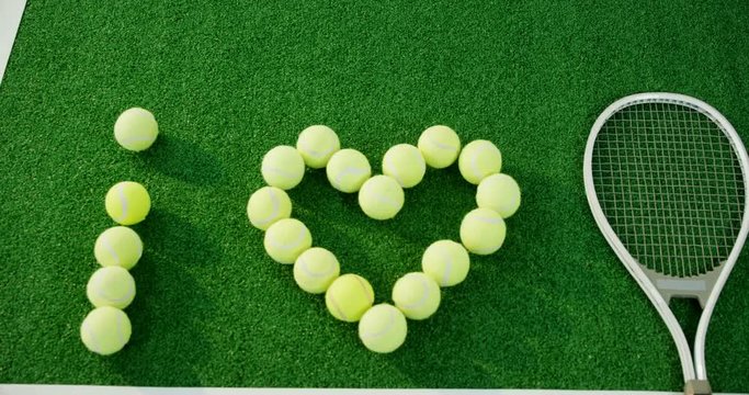 Tennis balls arranged in heart shape 
