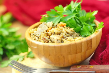 Pilaf with meat, vegetables and herbs.
