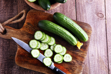 Fresh and sliced cucumbers. Sliced cucumbers on a cutting board. cucumbers for diet and healthy eating