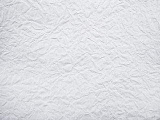 White crumpled paper background.