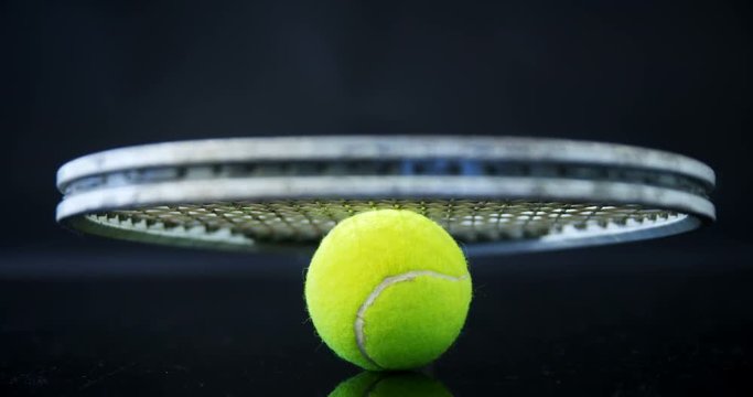 Tennis ball and racket in studio 