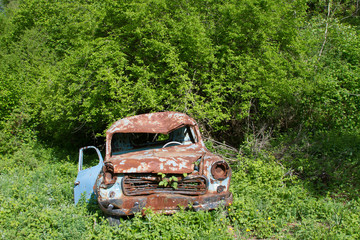 old rusty car at garden