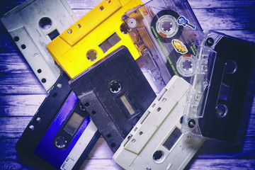Old cassette tapes with a wooden background