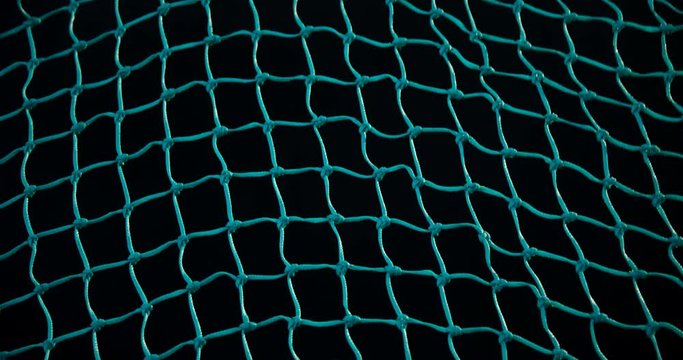 Tennis ball hitting net 
