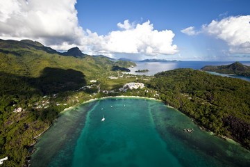 The coast of Pointe L'escalier, NYS Village in the back, Island of Mahe, Seychelles, Indian Ocean, Africa