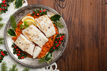 Christmas fish. Roasted cod pieces, served in vegetable sauce.