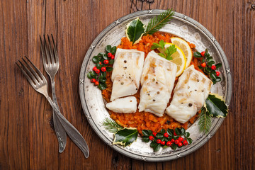 Christmas fish. Roasted cod pieces, served in vegetable sauce.