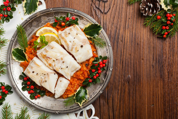 Christmas fish. Roasted cod pieces, served in vegetable sauce.