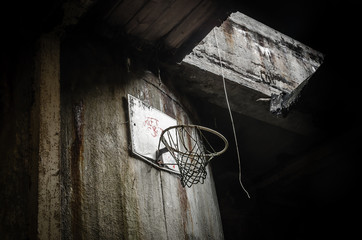 old basketball basket in the dark