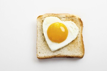 Toast with heart-shaped fried egg