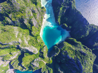 Aerial top view of turquoise lagoon in heart shape "Love" inside of rocky tropical island. Natural swimming pool at Phi Phi Leh island, Krabi, Thailand © Marina