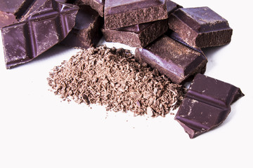 bar of chopped chocolate isolated on white