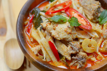 spicy bamboo shoot with chicken in coconut cream and red curry
