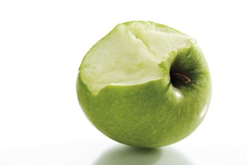 Green apple which has been bitten into