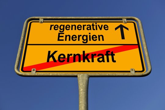 Symbolic image in the form of a town sign, in German, exit from nuclear power, entrance into regenerative energy sources
