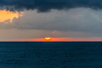 Naklejka na ściany i meble sea landscape with dramatic sea sunset over the Black sea