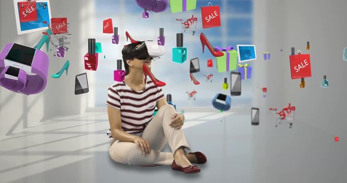 Woman using virtual reality headset with digitally generated sale icons 