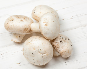 Champignon Mushrooms on Vintage Rustic Wooden Table Background