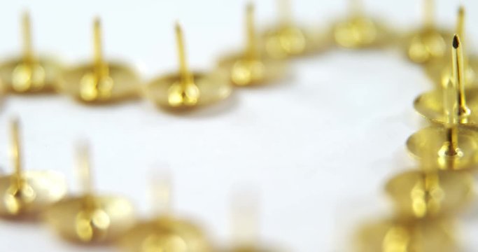 Golden Push Pin Arranged In Heart Shape 