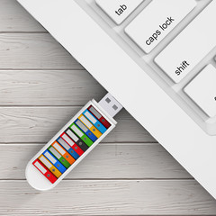 Computer Business Concept. Colorful Office Folders in USB Flash Drive Conected to Laptop. 3d...