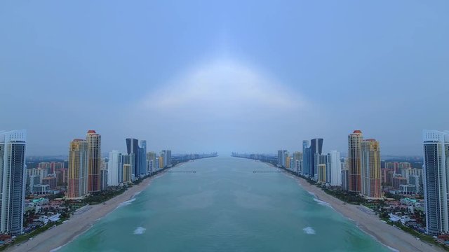 Aerial mirror effect buildings on the beach