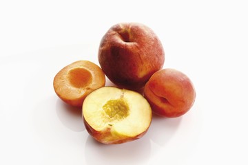 Apricot and peach, whole and halved