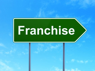 Business concept: Franchise on road sign background