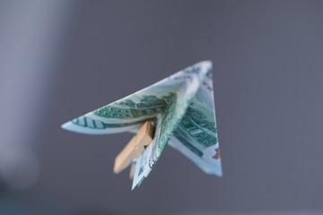 dollar banknote paper airplane